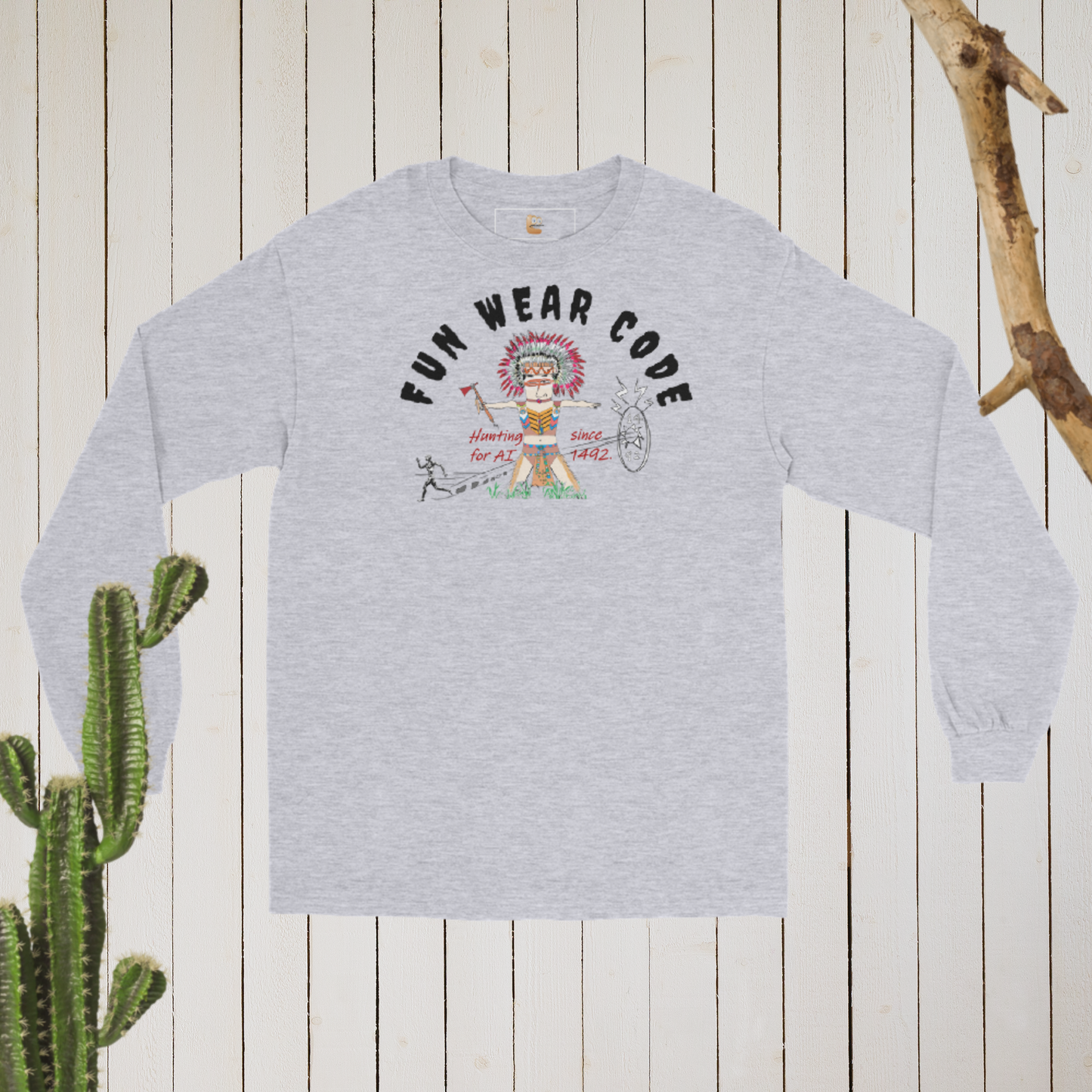 Gray long-sleeve shirt with a playful American Indian graphic design and text "Fun Wear Code" on a wooden surface with a cactus.
