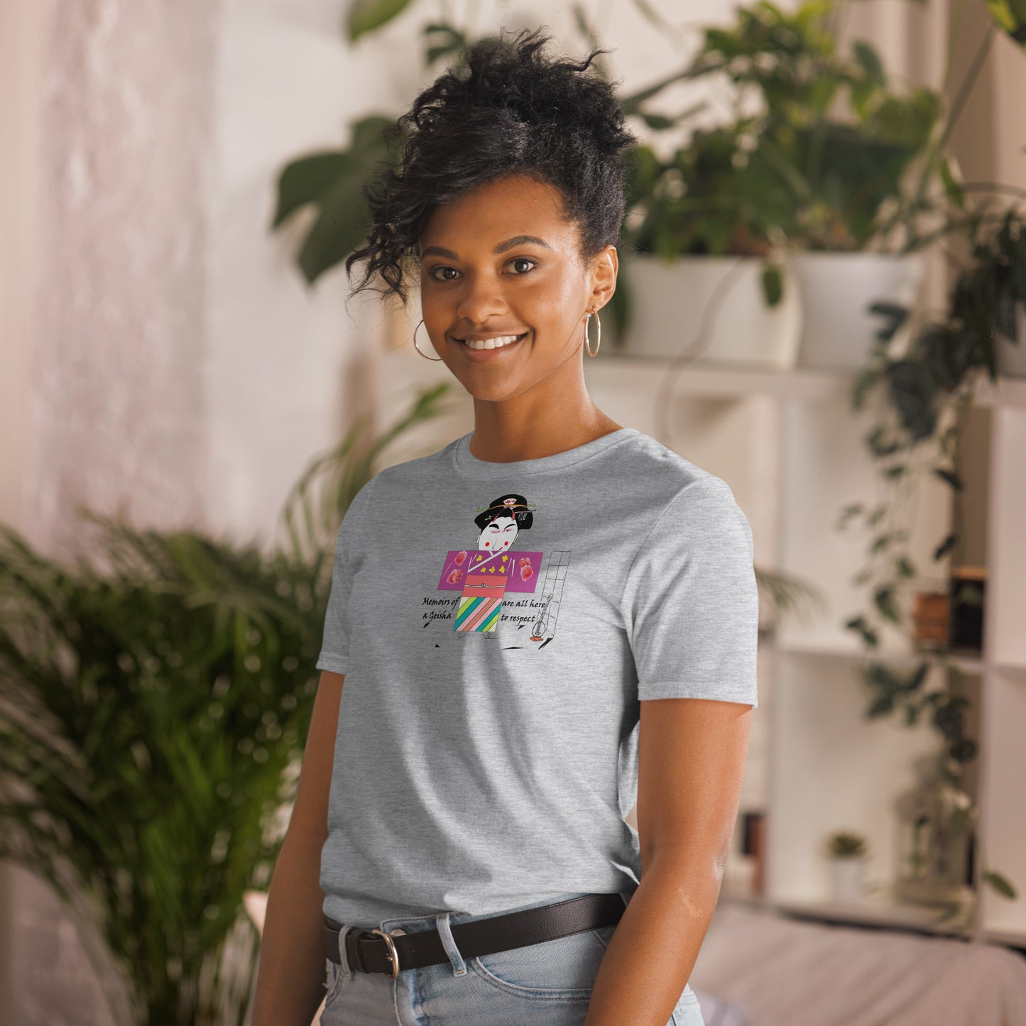 Left side view of a lady model wearing a gray t-shirt with a Japanese Geisha graphic design on a home background