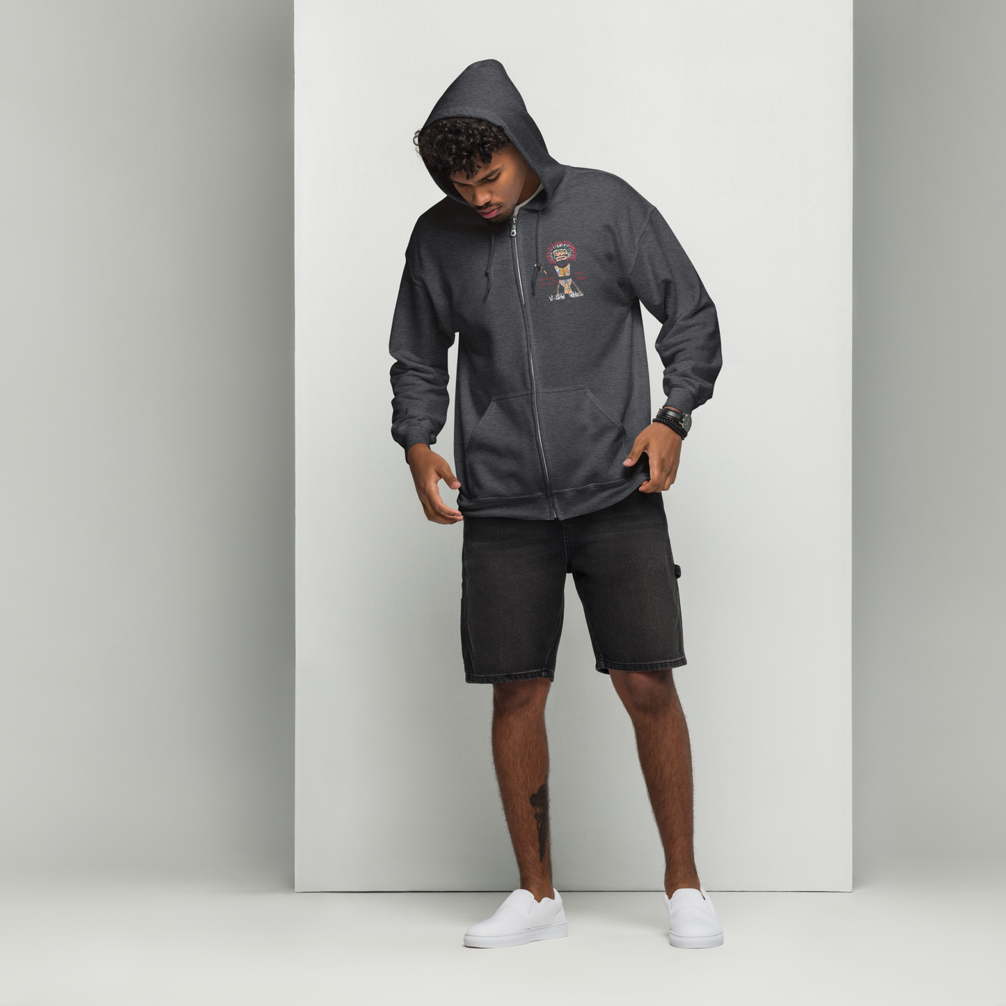Front view of a man model wearing a black zip-up hoodie with an American Indian man graphic design on a transparent background