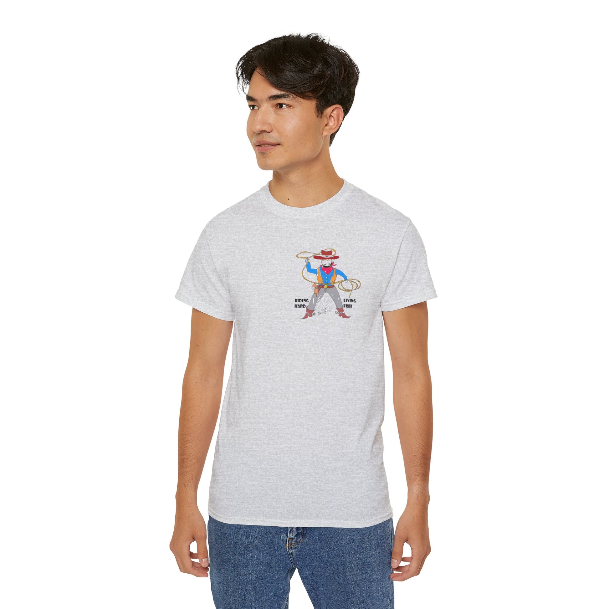 A man model wearing a gray t-shirt with a cowboy graphic design standing on a white background
