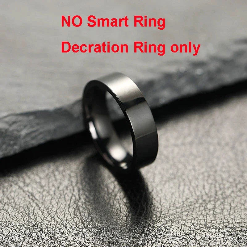 Black ring on a textured gray surface with text indicating it is a decoration ring only.