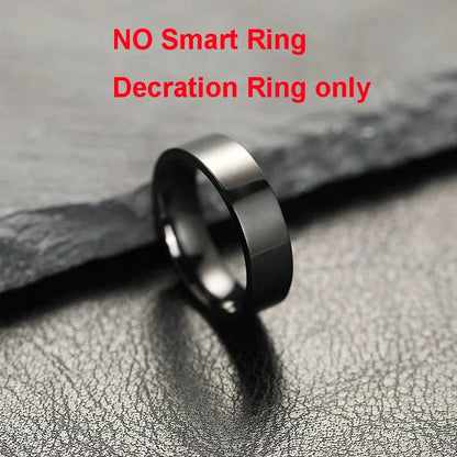 Black ring on a textured gray surface with text indicating it is a decoration ring only.