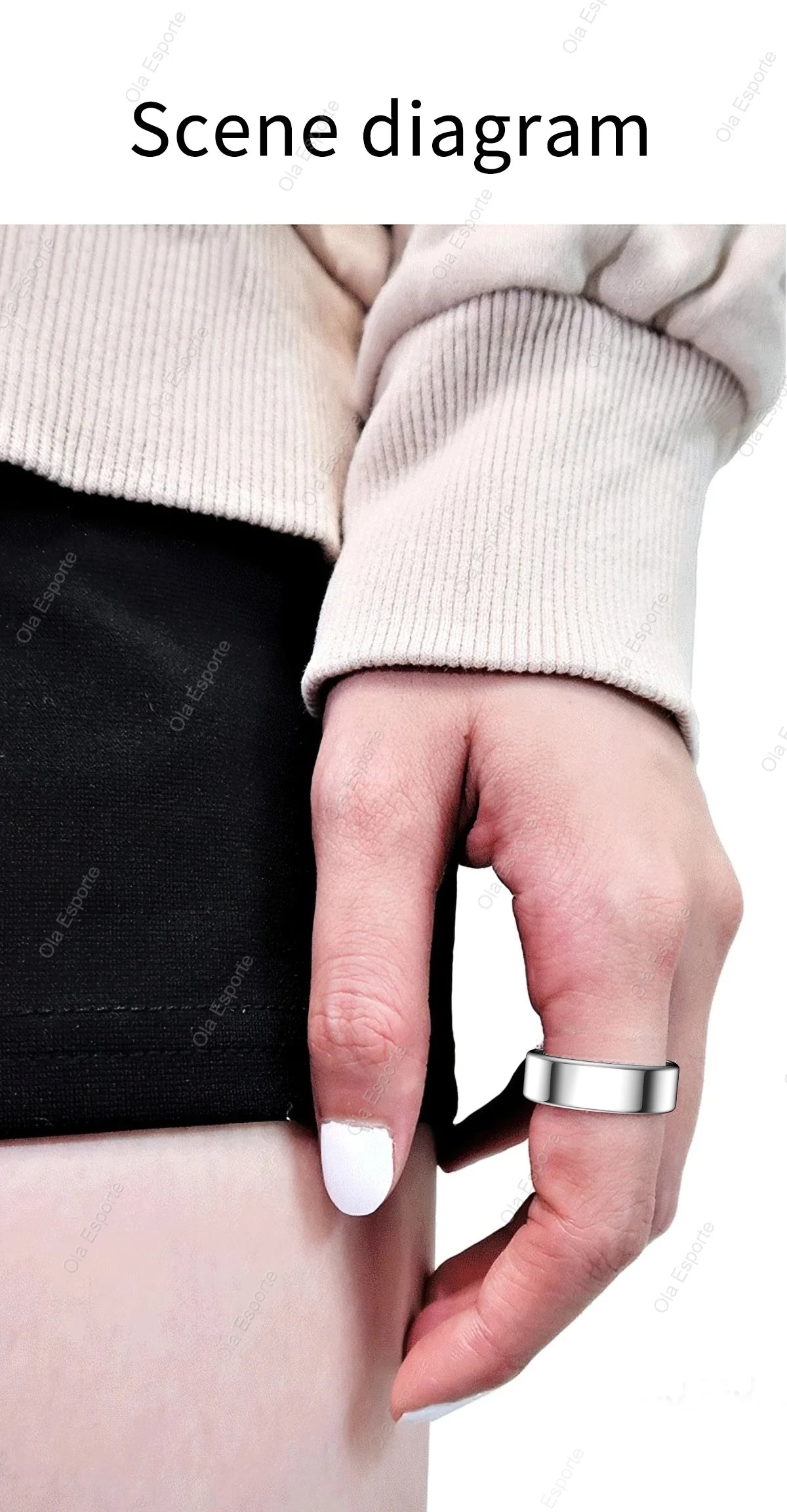 Close-up of a hand wearing a silver ring on a plain background