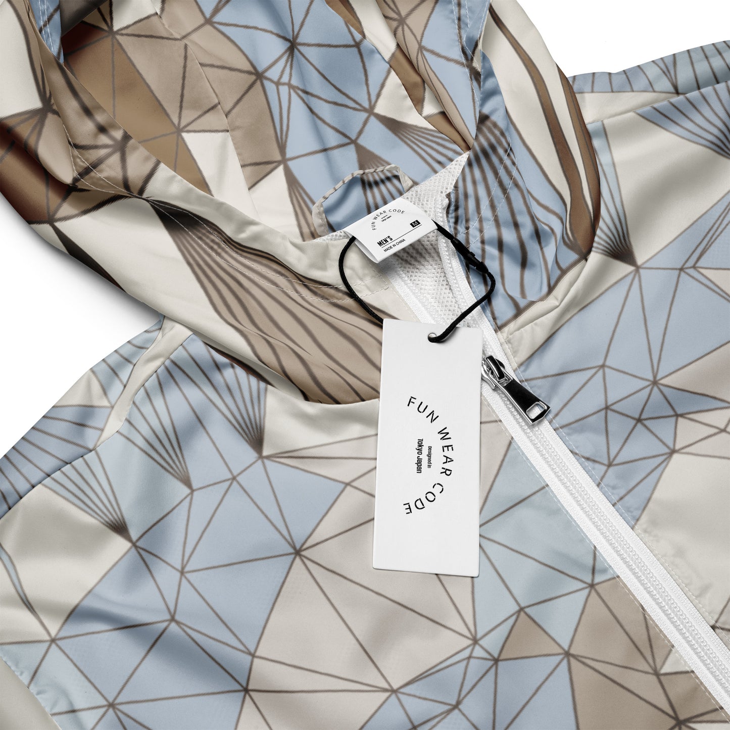 Geometric-patterned jacket with a visible brand tag on a white background