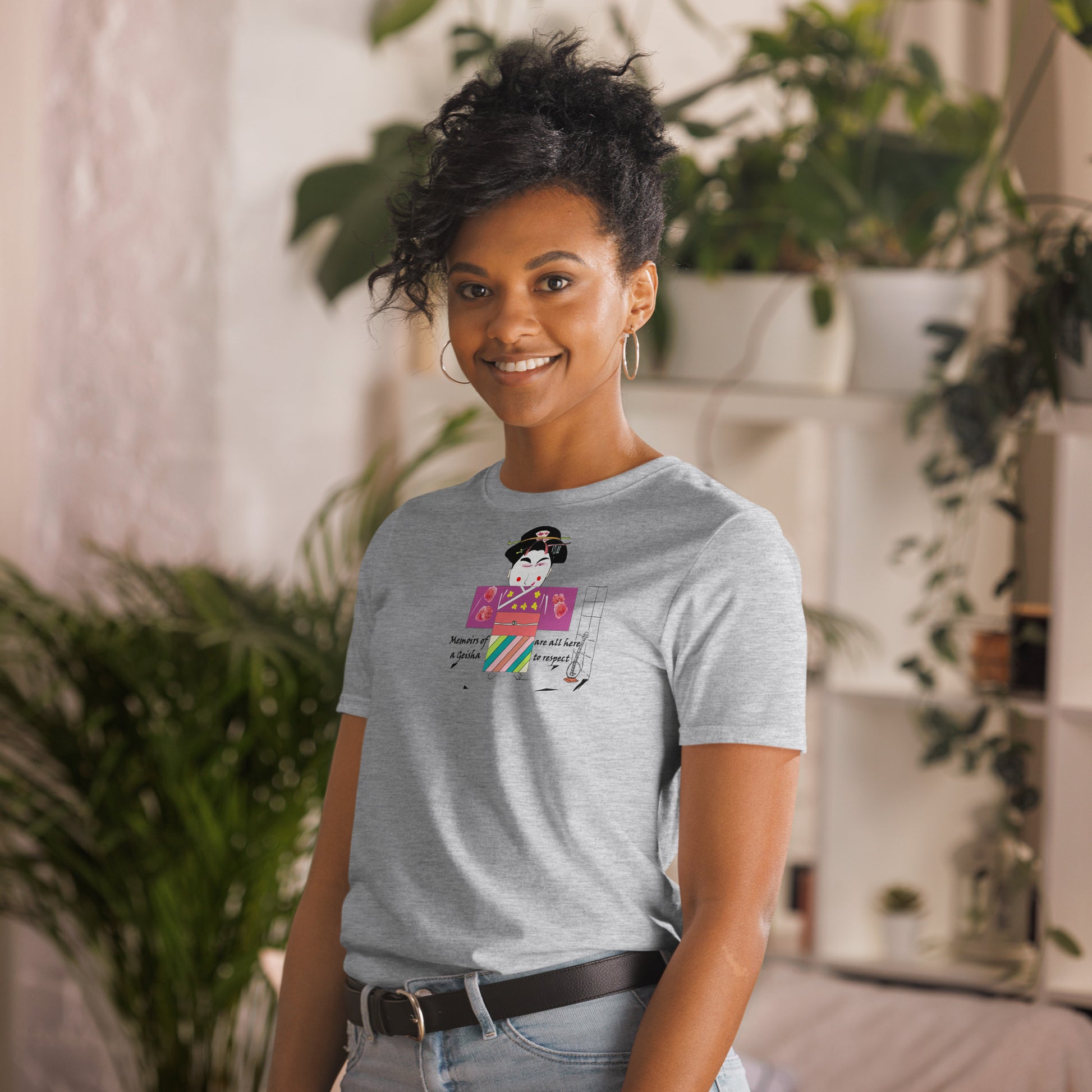 Left side view of a lady model wearing a gray t-shirt with a Japanese Geisha graphic design on a home background